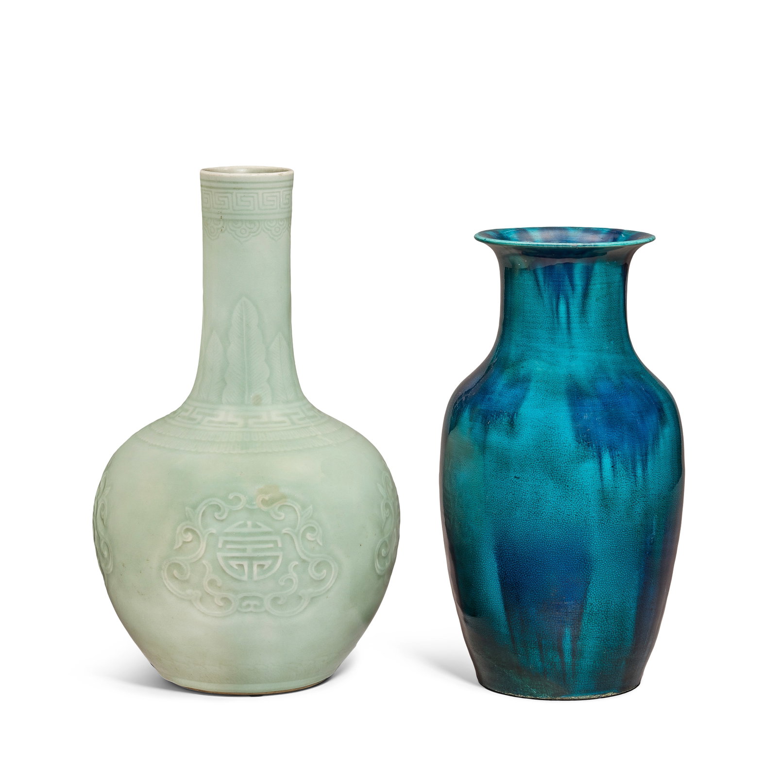 A CELADON GLAZED VASE AND A FLAMBÉ GLAZED VASE 19th century (2): A CELADON GLAZED VASE AND A FLAMBÉ GLAZED VASE 19th century The celadon vase with ovoid body rising to a slender cylindrical neck, moulded with shou medallions on four sides bordered by a band of