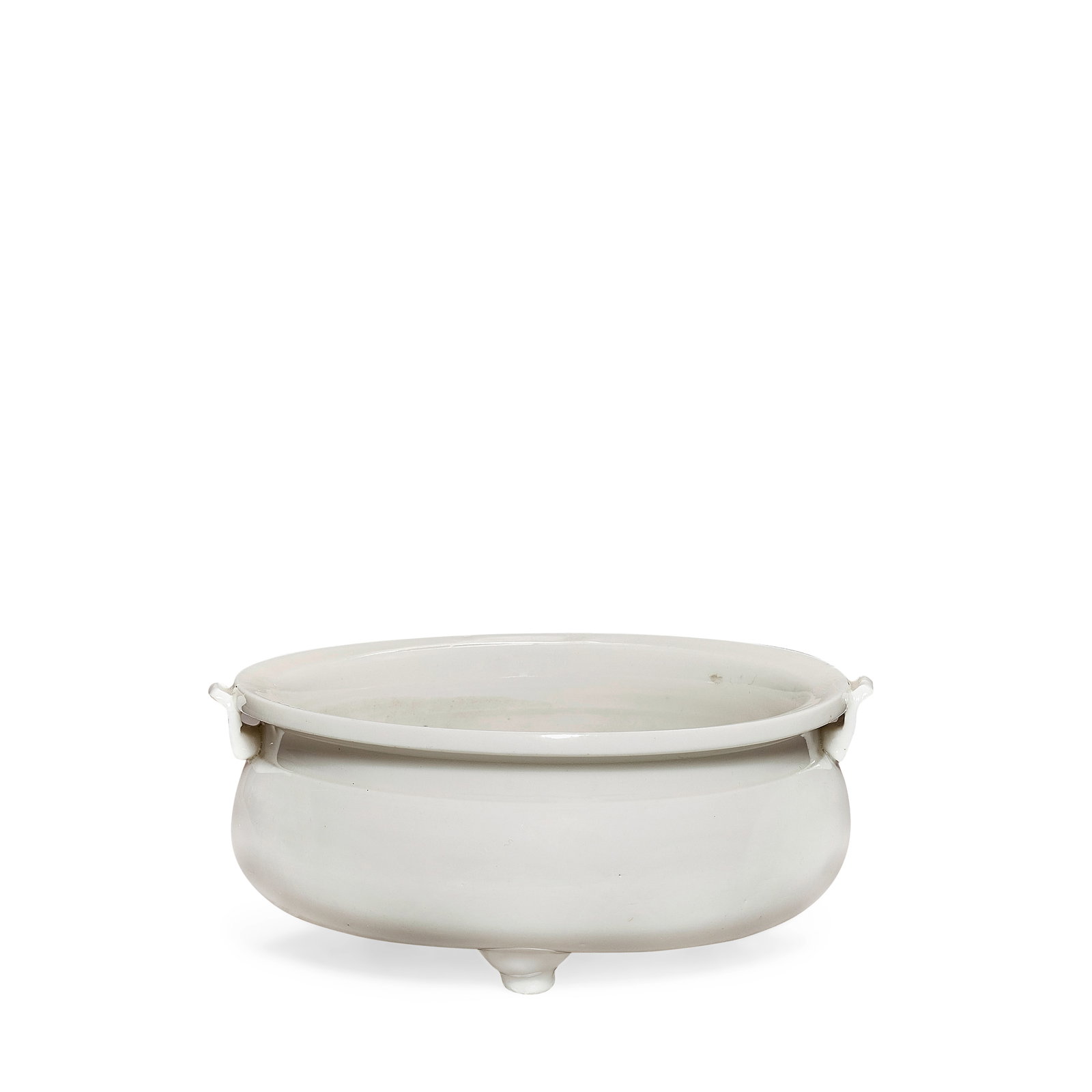 A BLANC-DE-CHINE TRIPOD INCENSE BURNER 17th/18th century: A BLANC-DE-CHINE TRIPOD INCENSE BURNER 17th/18th century Raised on short cabriole feet, the rounded body rising to an everted rim, the shoulders set with S-shaped handles, supported on the rim. 14.8cm