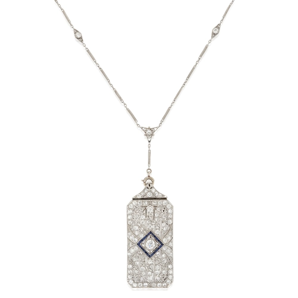 AN ART DECO PLATINUM AND DIAMOND CONVERTIBLE PENDANT/BROOCH AND CHAIN: AN ART DECO PLATINUM AND DIAMOND CONVERTIBLE PENDANT/BROOCH AND CHAIN The plaque brooch set with old European and old mine-cut diamonds, approximate total weight 3.50 carats, with pierced foliate moti