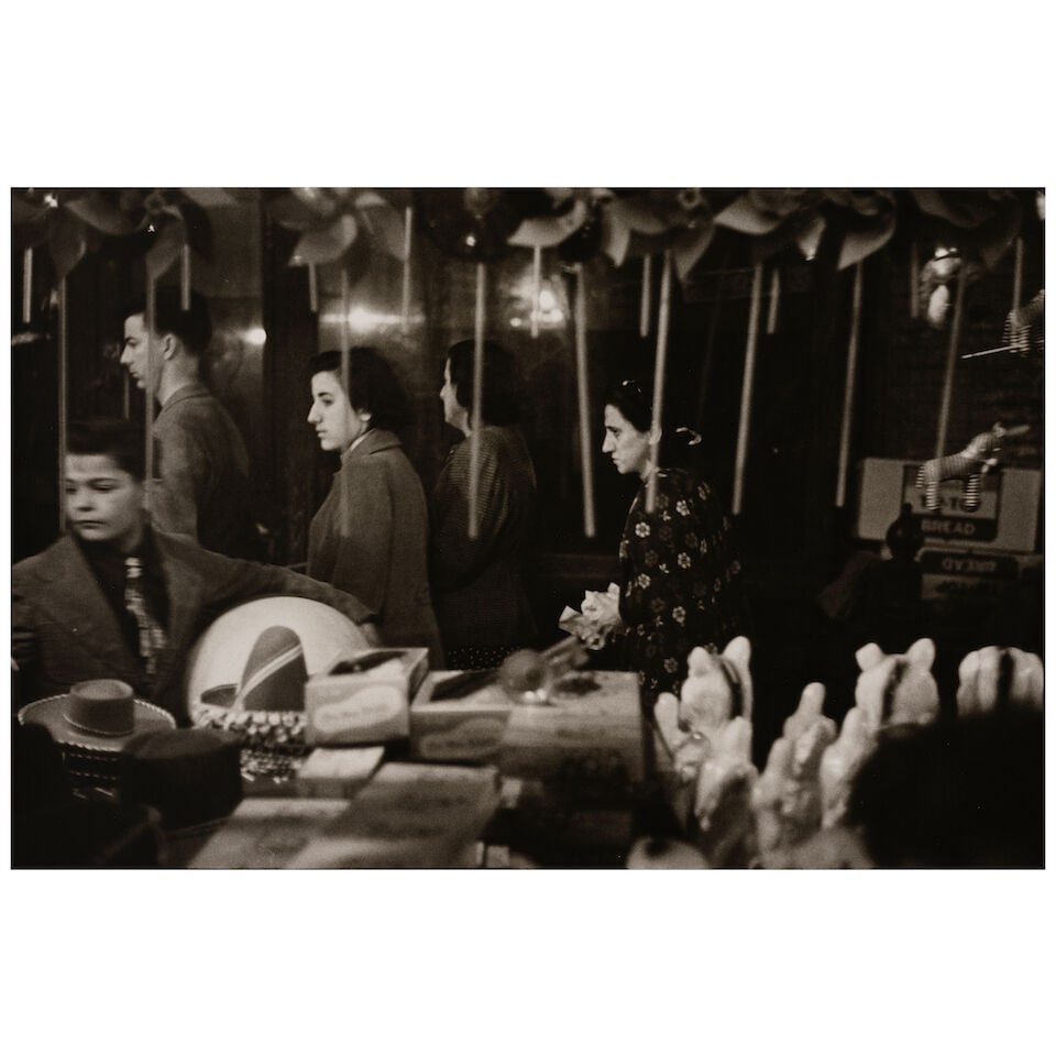 Louis Faurer (1916-2001); 'San Gennaro Festival' (New York);: Louis Faurer (1916-2001) 'San Gennaro Festival' (New York), 1950 Gelatin silver print, printed later; signed, titled, dated, and inscribed in pencil on the reverse. 8 1/4 x 12 1/2 in. (21 x 31.8 cm.) 