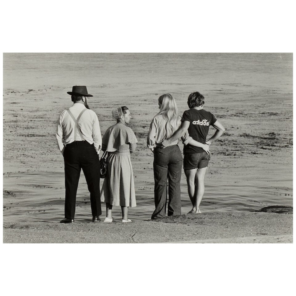 Elliott Erwitt (1928-2023); Pennsylvania Dutch and Adidas, Santa Cruz, U.S.A.;: Elliott Erwitt (1928-2023) Pennsylvania Dutch and Adidas, Santa Cruz, U.S.A., 1975 Gelatin silver print; signed in pencil on the reverse, framed. 8 x 11 7/8 in. (20.2 x 30.1 cm) sheet 11 x 13 7/8 in. 