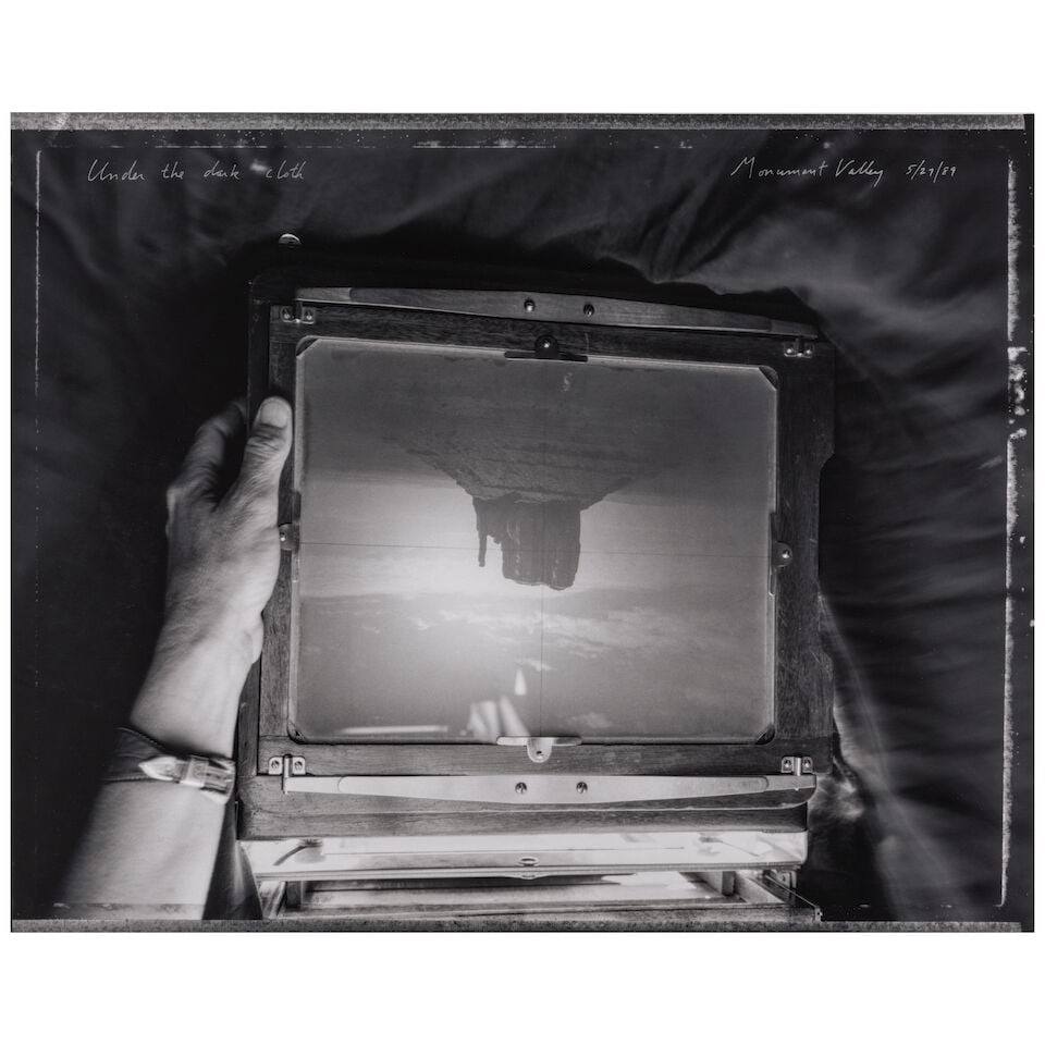 Mark Klett (born 1952); 'Under the dark cloth, Monument Valley';: Mark Klett (born 1952) 'Under the dark cloth, Monument Valley', 1989 Gelatin silver print, printed later; titled and dated in silver ink on the image, signed, dated, and editioned '40/50' in pencil on
