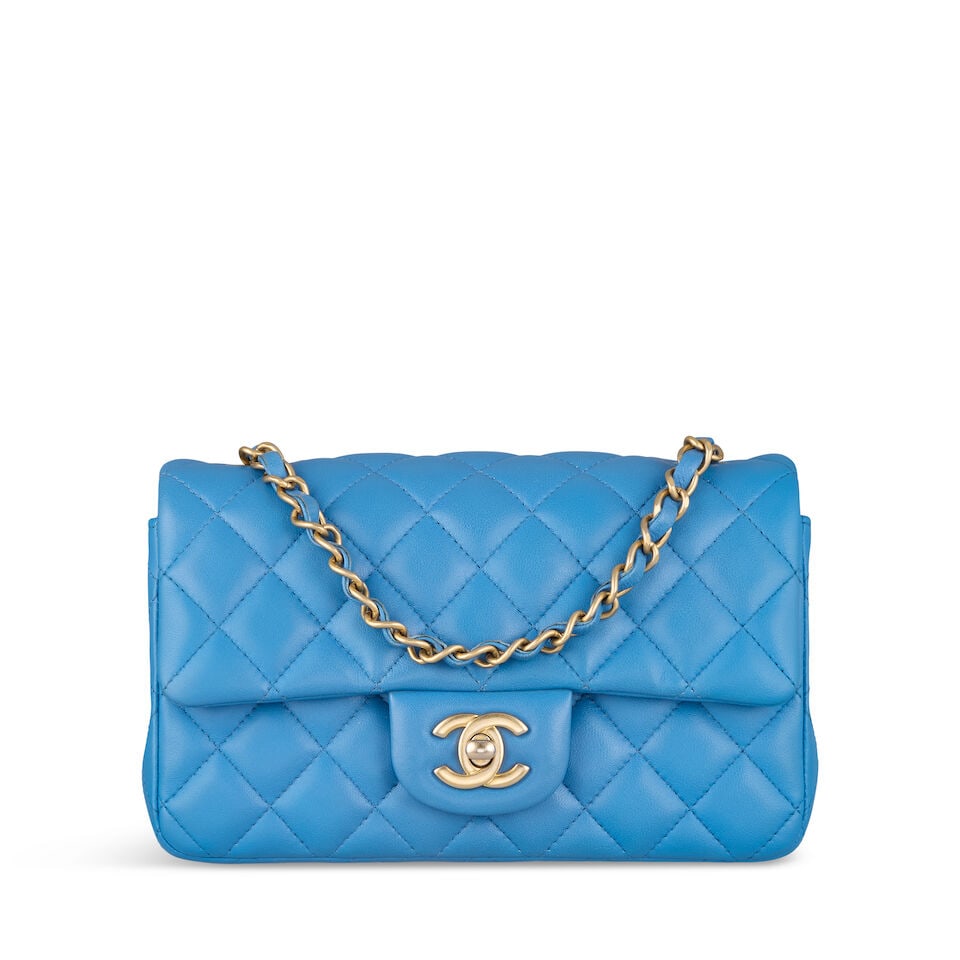 Chanel: a Blue Quilted Lambskin Mini Flap Bag 2019-20 (includes serial sticker, authenticity car...: Chanel: a Blue Quilted Lambskin Mini Flap Bag 2019-20 Quilted blue lambskin with antique gold tone hardware Condition Grade A- 20cm wide, 12cm high, 7cm deep, 58cm shoulder drop, includes serial stick