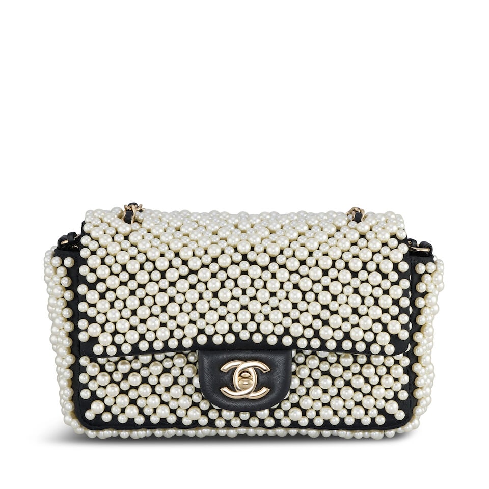 Chanel: a Pearl-On Flap Bag Spring/Summer 2019 (includes serial sticker, authenticity card and d...: Chanel: a Pearl-On Flap Bag Spring/Summer 2019 Single flap black satin bag, embellished all over with simulated pearl beads, lambskin flap, chain shoulder strap and gold tone hardware Condition Grade 