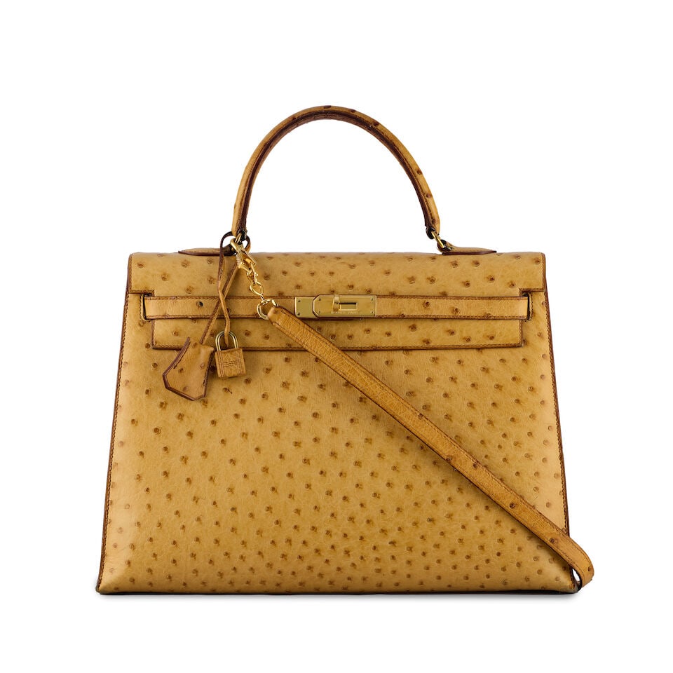 Hermès: a Tabac Camel Ostrich Sellier Kelly 35 1991 (includes padlock, keys, cloche and dus...: Hermès: a Tabac Camel Ostrich Sellier Kelly 35 1991 Gold tone hardware Condition Grade D+ 35cm wide, 25cm high, 12.5cm deep, 10cm handle drop, 40cm shoulder drop, includes padlock, keys, cloche