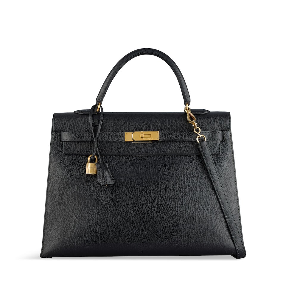 Hermès: a Black Ardennes Leather Sellier Kelly 35 1990 (includes padlock, keys, cloche, sho...: Hermès: a Black Ardennes Leather Sellier Kelly 35 1990 Gold tone hardware Condition Grade C+ 35cm wide, 25cm high, 12.5cm deep, 10cm handle drop, 41cm shoulder drop, includes padlock, keys,