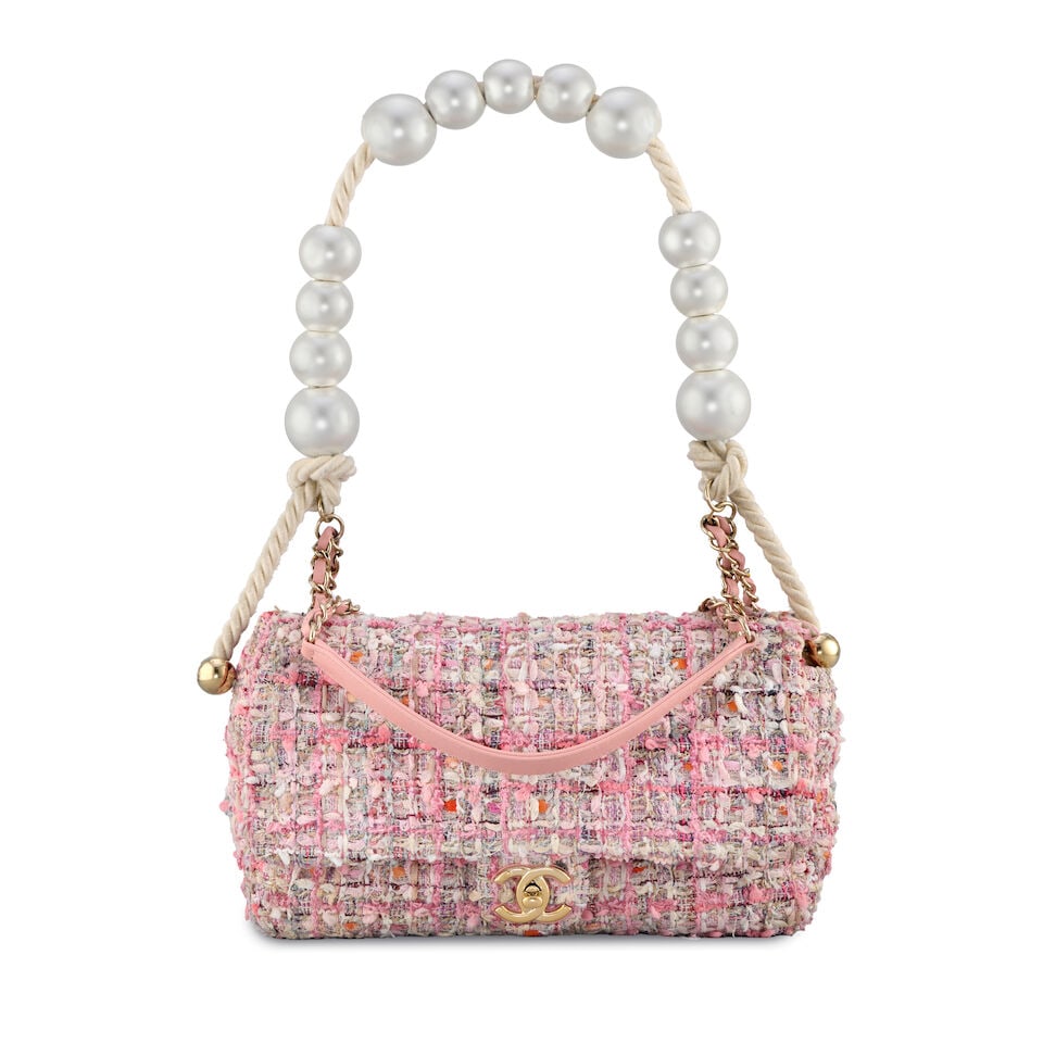 Chanel: a Pink Tweed and Simulated Pearl Flap Bag Spring 2019 (includes serial sticker): Chanel: a Pink Tweed and Simulated Pearl Flap Bag Spring 2019 Creative Director: Karl Lagerfeld Multicolour tweed in shades of pink, leather threaded chain shoulder strap and a simulated pearl top