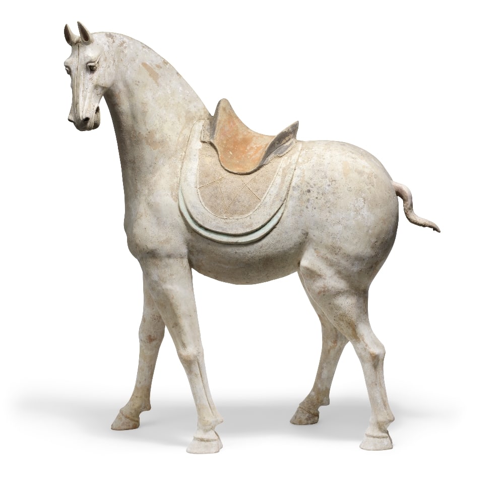 A VERY LARGE LARGE PAINTED POTTERY MODEL OF A HORSE Tang Dynasty: A VERY LARGE LARGE PAINTED POTTERY MODEL OF A HORSE Tang Dynasty Finely modelled with a muscular frame, the head turned slightly to the left, the ears pricked and the mouth open, with a hogged mane an