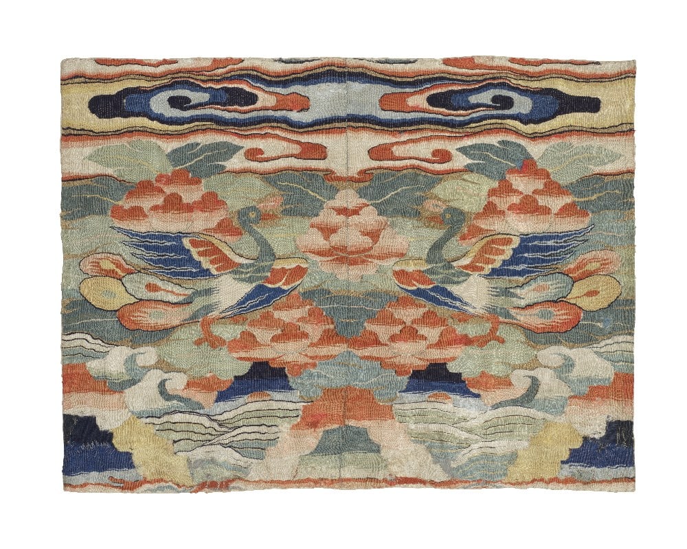 A KESI CIVIL OFFICIAL'S 'PEACOCK' RANK BADGE, BUZI Ming Dynasty: A KESI CIVIL OFFICIAL'S 'PEACOCK' RANK BADGE, BUZI Ming Dynasty Finely embroidered with a pair of peacocks, each depicted with outstretched wings and a luxuriant trailing tail, set against a multi-col