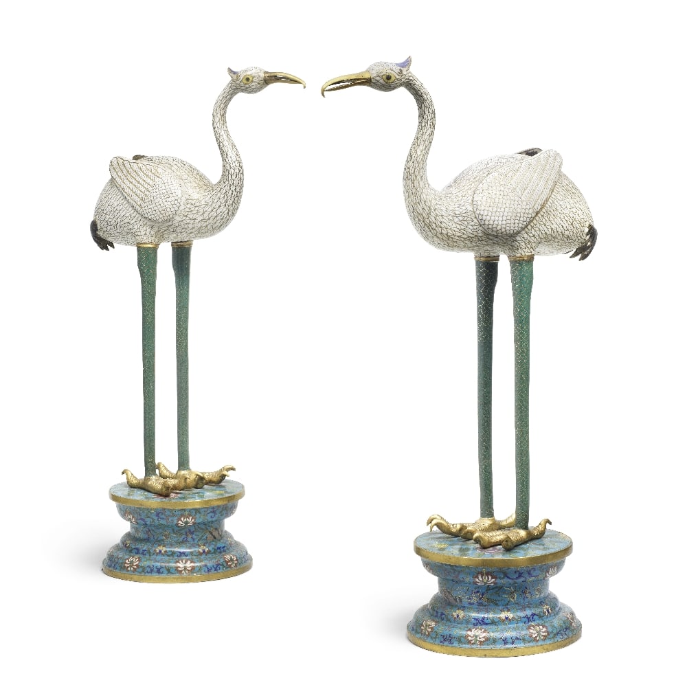 A LARGE PAIR OF CLOISONNÉ ENAMEL MODELS OF CRANES Late Qing Dynasty (2): A LARGE PAIR OF CLOISONNÉ ENAMEL MODELS OF CRANES Late Qing Dynasty Each bird standing on tall straight legs supporting a white enamel body with finely delineated plumage, joined to an elegantly 