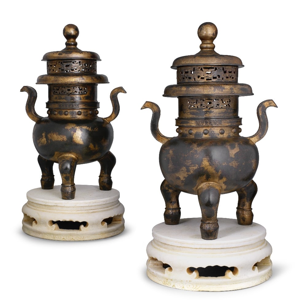 A RARE PAIR OF LARGE IMPERIAL GILT BRONZE INCENSE BURNERS, COVERS AND MARBLE STANDS Qianlong six...: A RARE PAIR OF LARGE IMPERIAL GILT BRONZE INCENSE BURNERS, COVERS AND MARBLE STANDS Qianlong six-character marks and of the period Each sturdily cast with a globular body set with a pair of scroll han