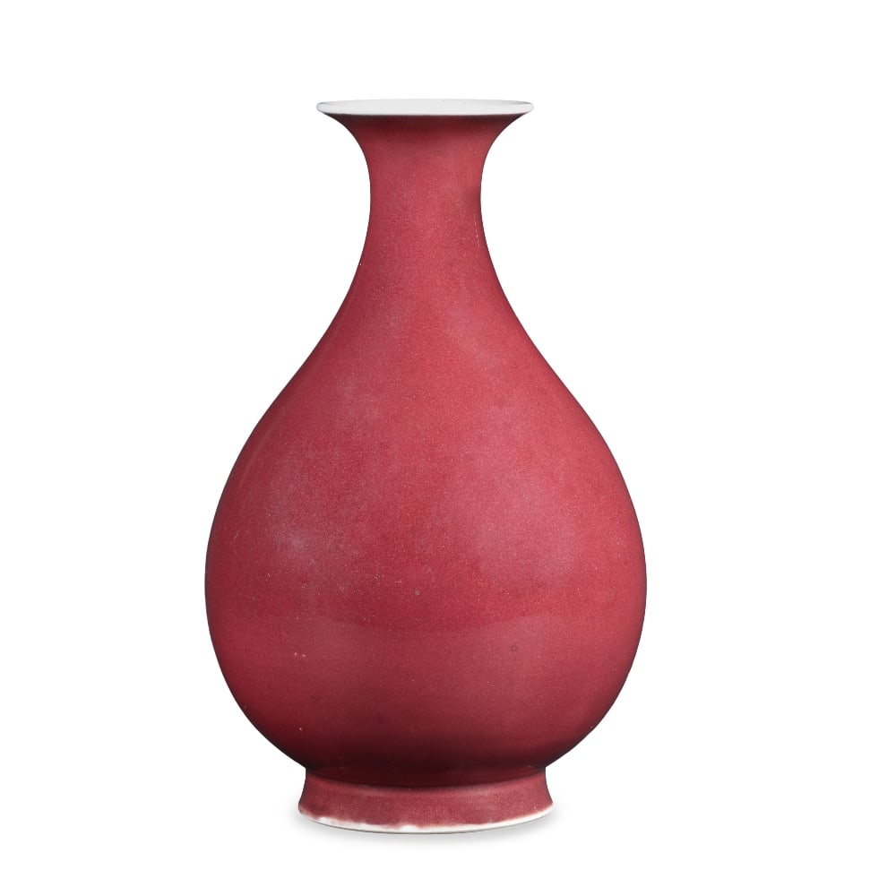 A RARE COPPER-RED-GLAZED PEAR-SHAPED VASE, YUHUCHUNPING Daoguang seal mark and of the period: A RARE COPPER-RED-GLAZED PEAR-SHAPED VASE, YUHUCHUNPING Daoguang seal mark and of the period Elegantly potted with a pear-shaped body rising from a spreading foot to a waisted neck terminating at a fl