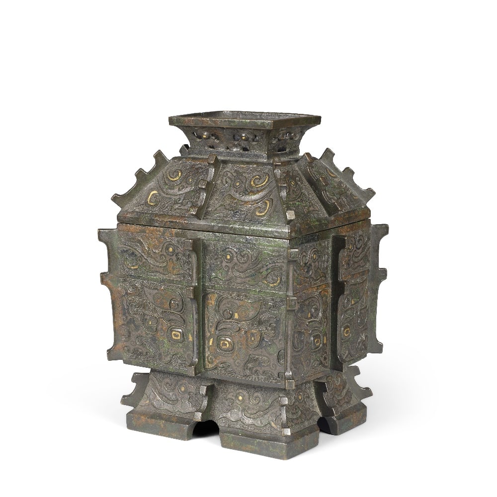 A RARE ARCHAISTIC GOLD AND SILVER-INLAID BRONZE WINE VESSEL AND COVER, FANGYI 17th century (2): A RARE ARCHAISTIC GOLD AND SILVER-INLAID BRONZE WINE VESSEL AND COVER, FANGYI 17th century Expertly cast in the form of an archaic fangyi, the rectangular body raised on a spreading foot, rising up to