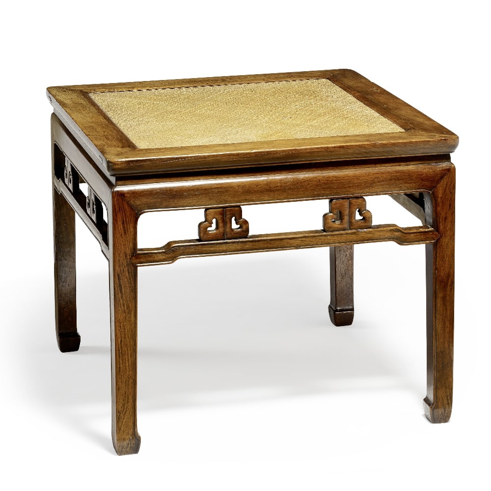 A LARGE HUANGHUALI SQUARE WAISTED CORNER-LEG STOOL 17th century: A LARGE HUANGHUALI SQUARE WAISTED CORNER-LEG STOOL 17th century Fitted with a woven cane seat within plain round-corner square frame above waisted section and plain apron with beaded edge, the whole s