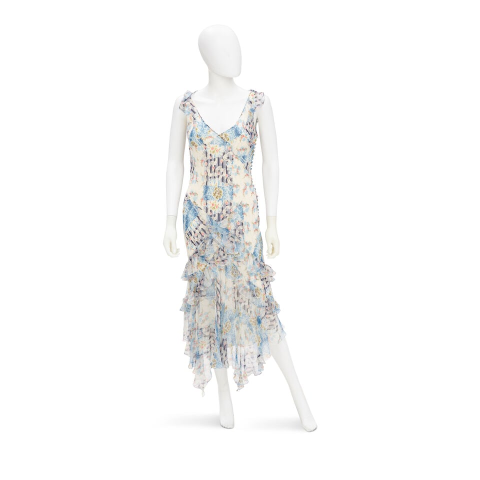 JOHN GALLIANO: BLUE SILK FLORAL PRINT DRESS Fall 2004: JOHN GALLIANO: BLUE SILK FLORAL PRINT DRESS Fall 2004 • Marked Size 40 • Blue Floral Silk Exterior • Button Closure For further information on this lot please visit Bonhams.com For
