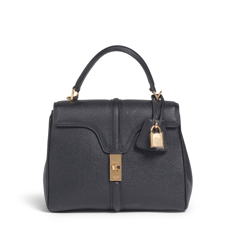 CELINE: BLACK GRAINED CALFSKIN SMALL 16 TOP HANDLE BAG 2018: CELINE: BLACK GRAINED CALFSKIN SMALL 16 TOP HANDLE BAG 2018 • Black Grained Calfskin Exterior • Gold Tone Hardware • Flap Top with Turn Lock Closure, Pochette, and Lock & Keys •