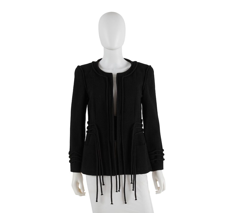 CHANEL: BLACK ROPE TRIM EVENING JACKET 2009-2010: CHANEL: BLACK ROPE TRIM EVENING JACKET 2009-2010 • Marked Size 42 • Black Wool Exterior • Three Button False Vest Closure • Fringe Rope Detail Throughout For further informatio