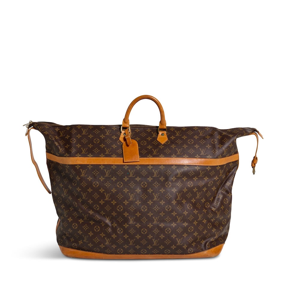 LOUIS VUITTON MONOGRAM CRUISER 55 Pre 1982: LOUIS VUITTON MONOGRAM CRUISER 55 Pre 1982 • Brown Coated Canvas Monogram Exterior • Gold Tone Hardware • Vachetta Trim Detail • Rolled Top Handle • Canvas Lined Interior