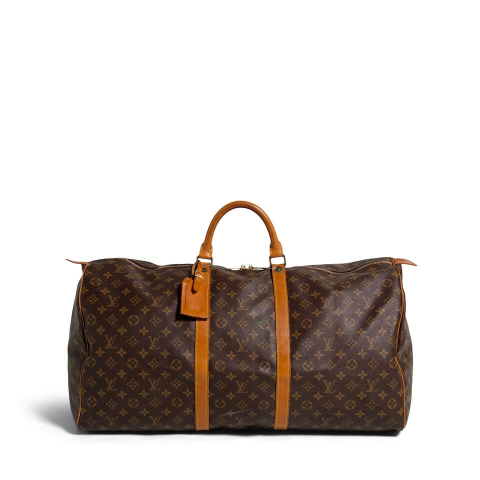 LOUIS VUITTON: MONOGRAM KEEPALL DUFFLE BAG 60 1984: LOUIS VUITTON: MONOGRAM KEEPALL DUFFLE BAG 60 1984 • Monogram Coated Canvas Exterior with Vachetta Trim • Brass Tone Hardware • Dual Rolled Handles • Zip Closure • Canvas