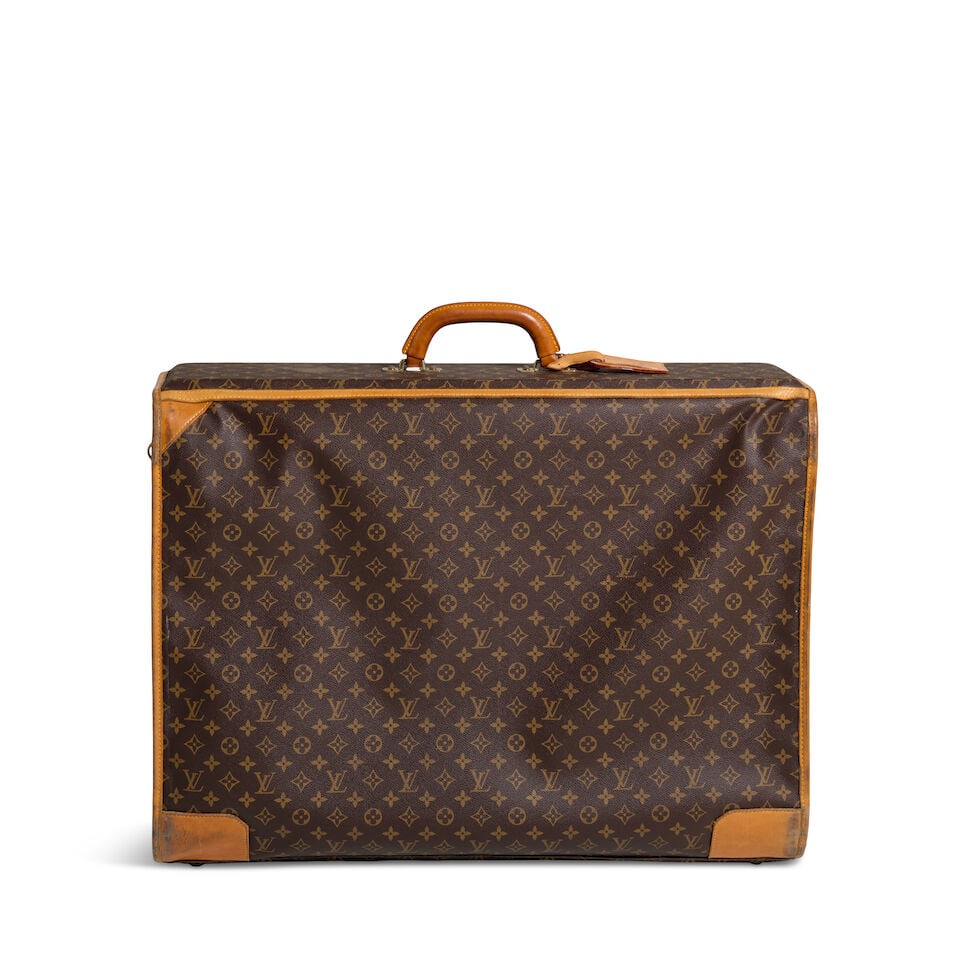 LOUIS VUITTON MONOGRAM LUGGAGE 1997: LOUIS VUITTON MONOGRAM LUGGAGE 1997 • Brown Coated Canvas Monogram Exterior • Gold Tone Hardware with Protective Feet • Vachetta Trim Detail • Rolled Top Handle • Fabric 