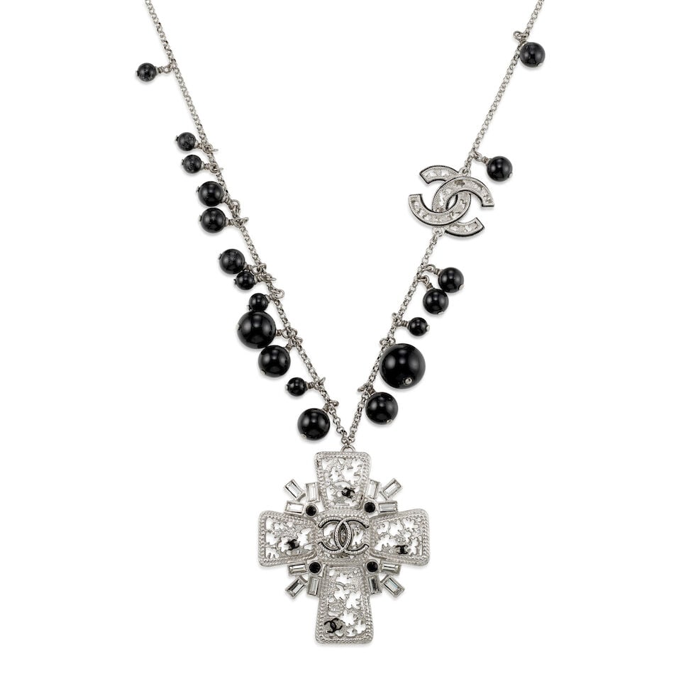 CHANEL: SILVER MALTESE CROSS CC PENDANT Fall 2010: CHANEL: SILVER MALTESE CROSS CC PENDANT Fall 2010 • Silver Tone Chain with Black Bead and CC Logo Detail • Maltese Cross with Baguette Crystals and Black Crystal Detail • Lobster Cla