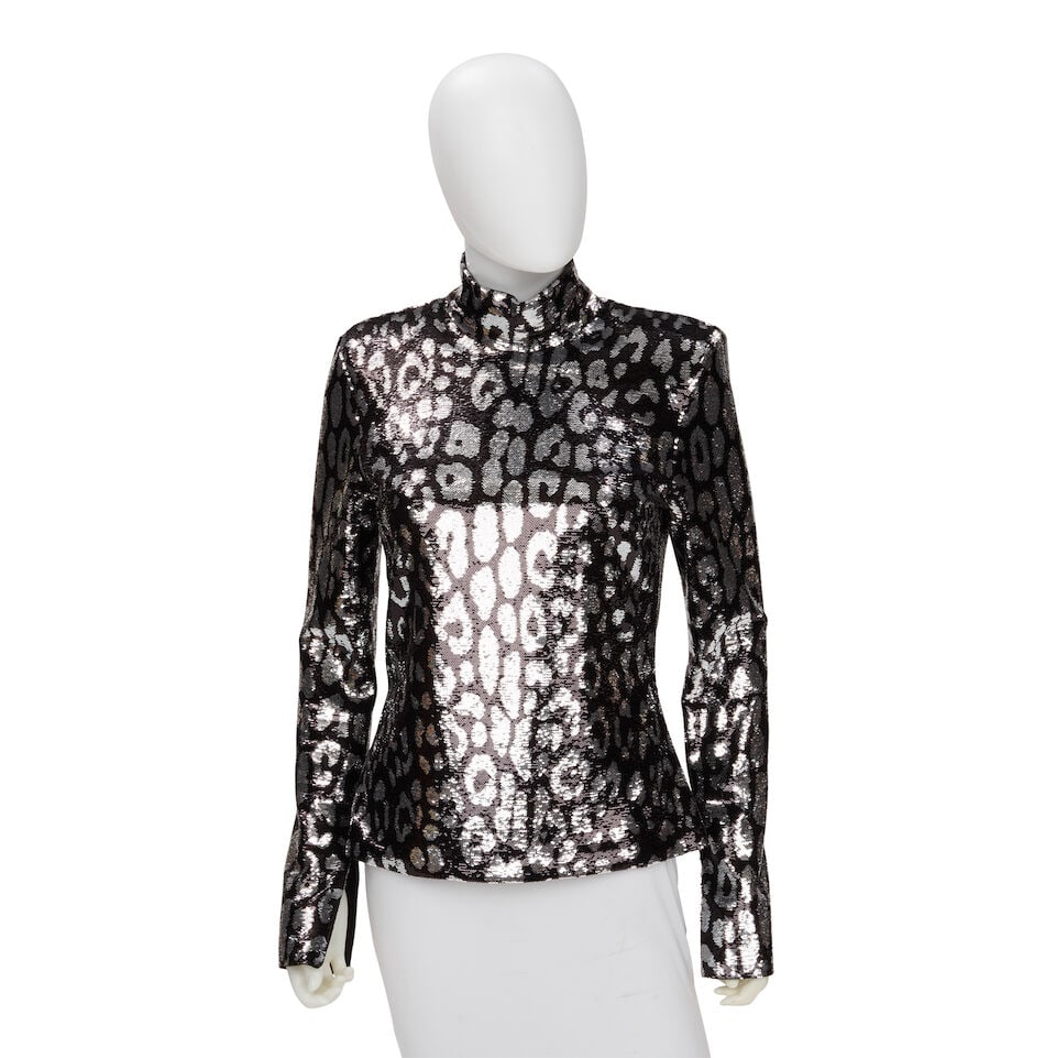 TOM FORD: SEQUIN EMBELLISHED ANIMAL PRINT blouse: TOM FORD: SEQUIN EMBELLISHED ANIMAL PRINT blouse • Marked Size 40 • Black and Silver Sequin Exterior • Back Zip Closure For further information on this lot please visit Bonhams.com F