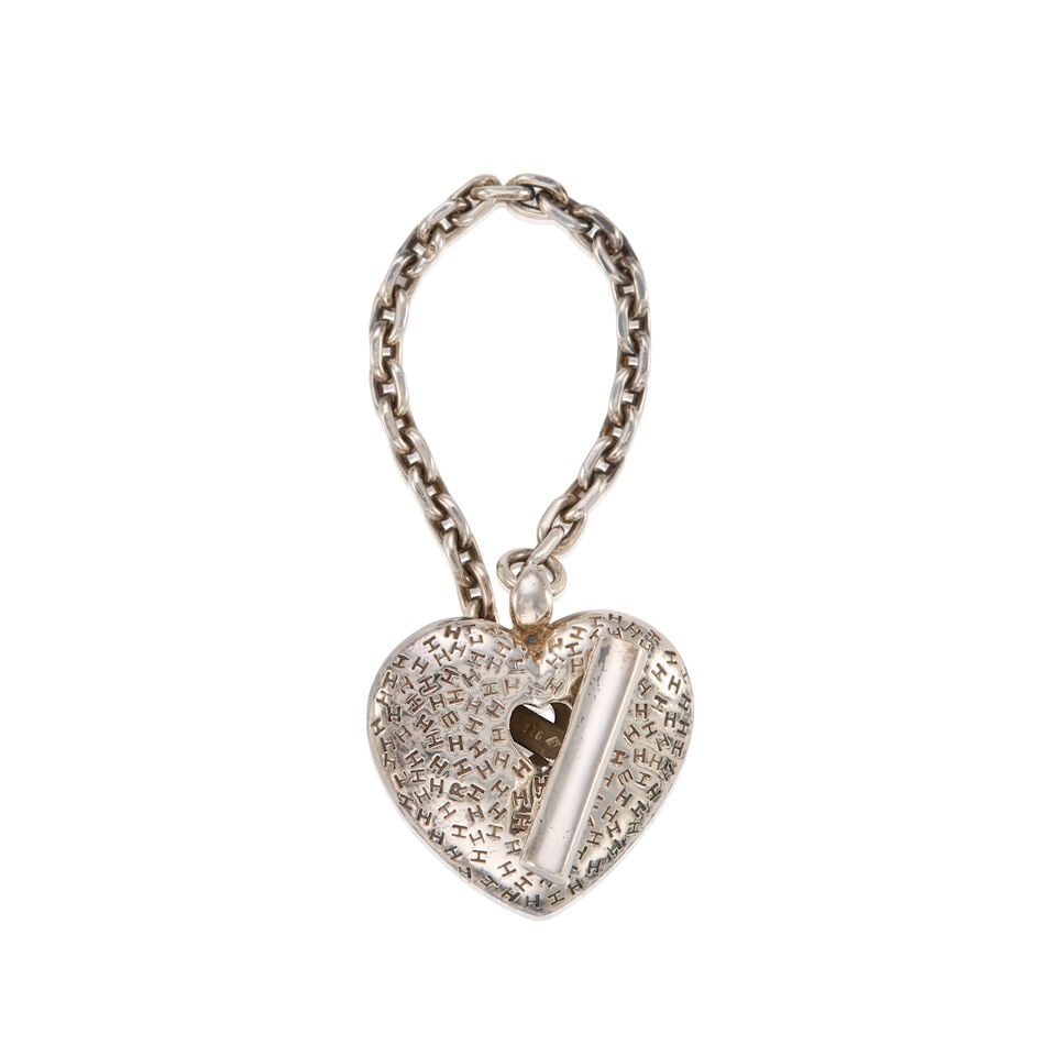 HERMÈS: SILVER HEART CHARM ON CHAIN: HERMÈS: SILVER HEART CHARM ON CHAIN • Marked 925 Sterling Silver • H Logo Detail Throughout • Toggle Clasp Closure • Chain Length 12 cm | Charm 2.5 cm x 2.5 cm For further