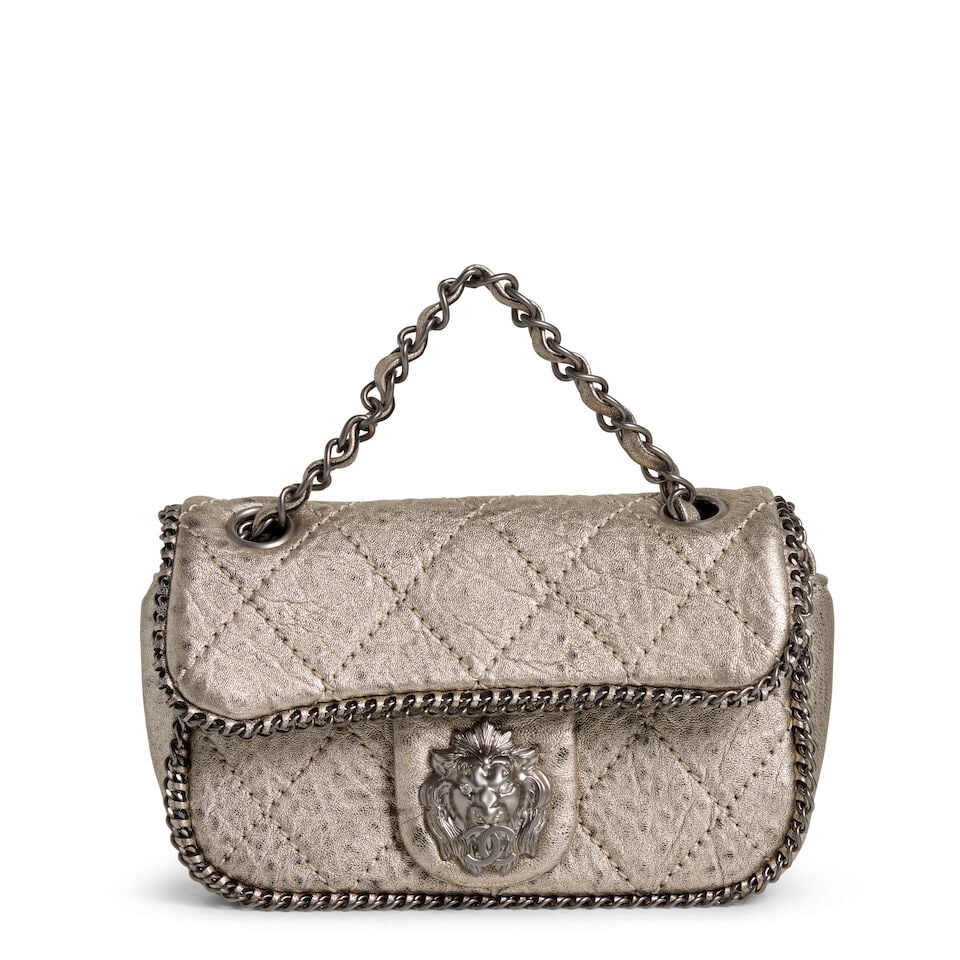 CHANEL: MINI LEO LION FLAP BAG 2006-2008: CHANEL: MINI LEO LION FLAP BAG 2006-2008 • Distressed Quilted Metallic Lambskin Exterior with Chain Embellishment • Pewter-Tone Hardware with Magnetic Flap Closure • Leather-Braided 