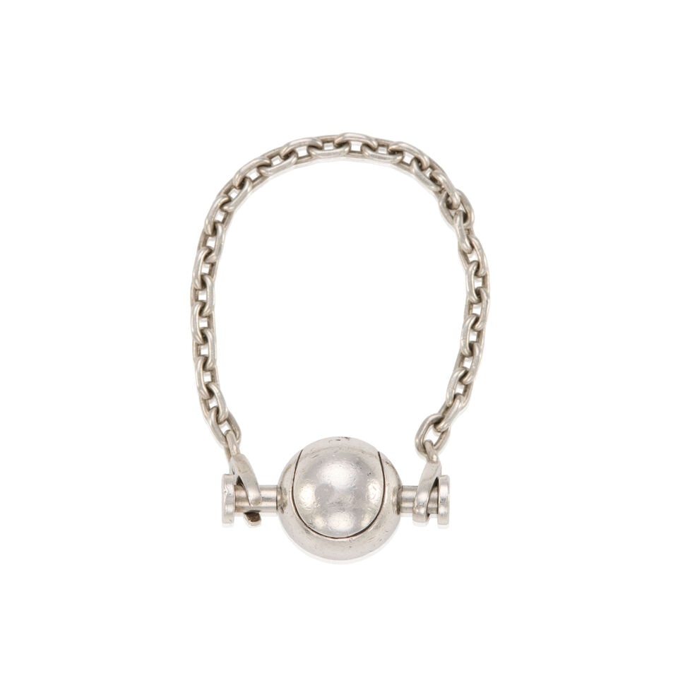 HERMÈS: SILVER TENNIS BALL CHARM ON CHAIN: HERMÈS: SILVER TENNIS BALL CHARM ON CHAIN • Marked 925 Sterling Silver • Push Lock Chain Closure • Chain Length 12 cm | Charm 1.5 cm x 1.5 cm For further information on this lot