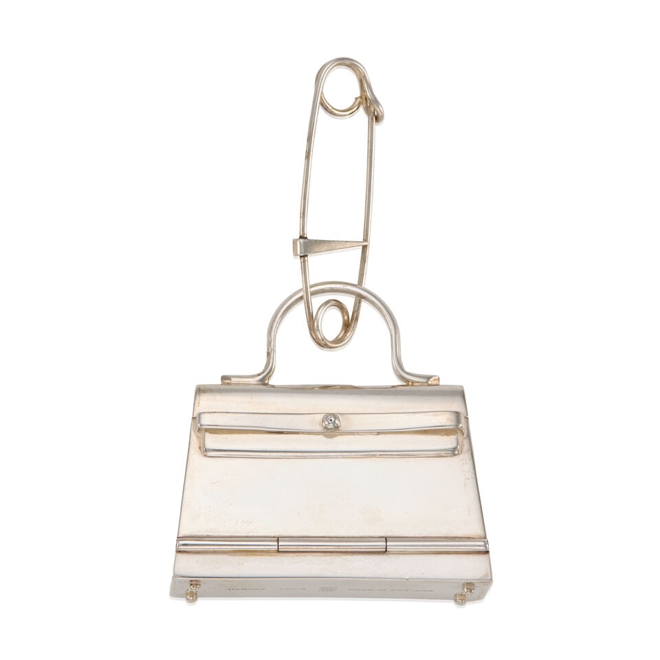 HERMÈS: SILVER KELLY PILL BOX WITH SAFETY PIN 1990's | 40 GRAMS: HERMÈS: SILVER KELLY PILL BOX WITH SAFETY PIN 1990's | 40 GRAMS • Marked Sterling Silver • Rare Inclusion of Working Safety Pin • Hinged Front Opening • Measures 4.5 cm x 