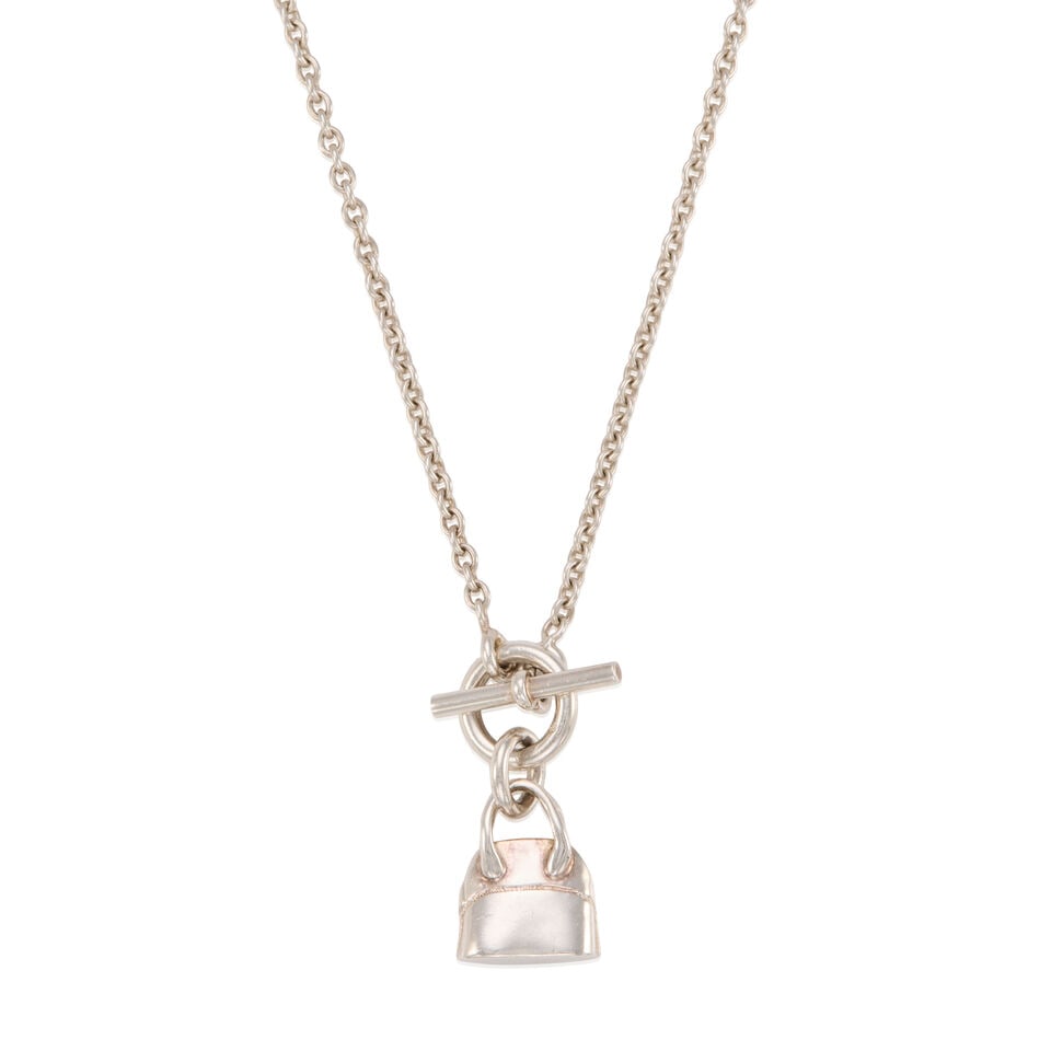 HERMÈS: SILVER MINI BOLIDE AMULETTE PENDANT NECKLACE: HERMÈS: SILVER MINI BOLIDE AMULETTE PENDANT NECKLACE • Marked 925 Sterling Silver • Toggle Clasp Closure • Jewelry Pouch Included • Chain Drop 20 cm | Pendant 1 cm x 1 cm 