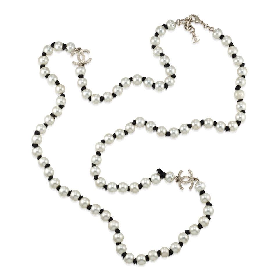 CHANEL: CC PEARL NECKLACE ON GROSGRAIN Fall 2016: CHANEL: CC PEARL NECKLACE ON GROSGRAIN Fall 2016 • Simulated Pearls on Knotted Grosgrain with Silver CC Logo Detail • Lobster Claps Closure • Measures 50 cm Drop For further informat