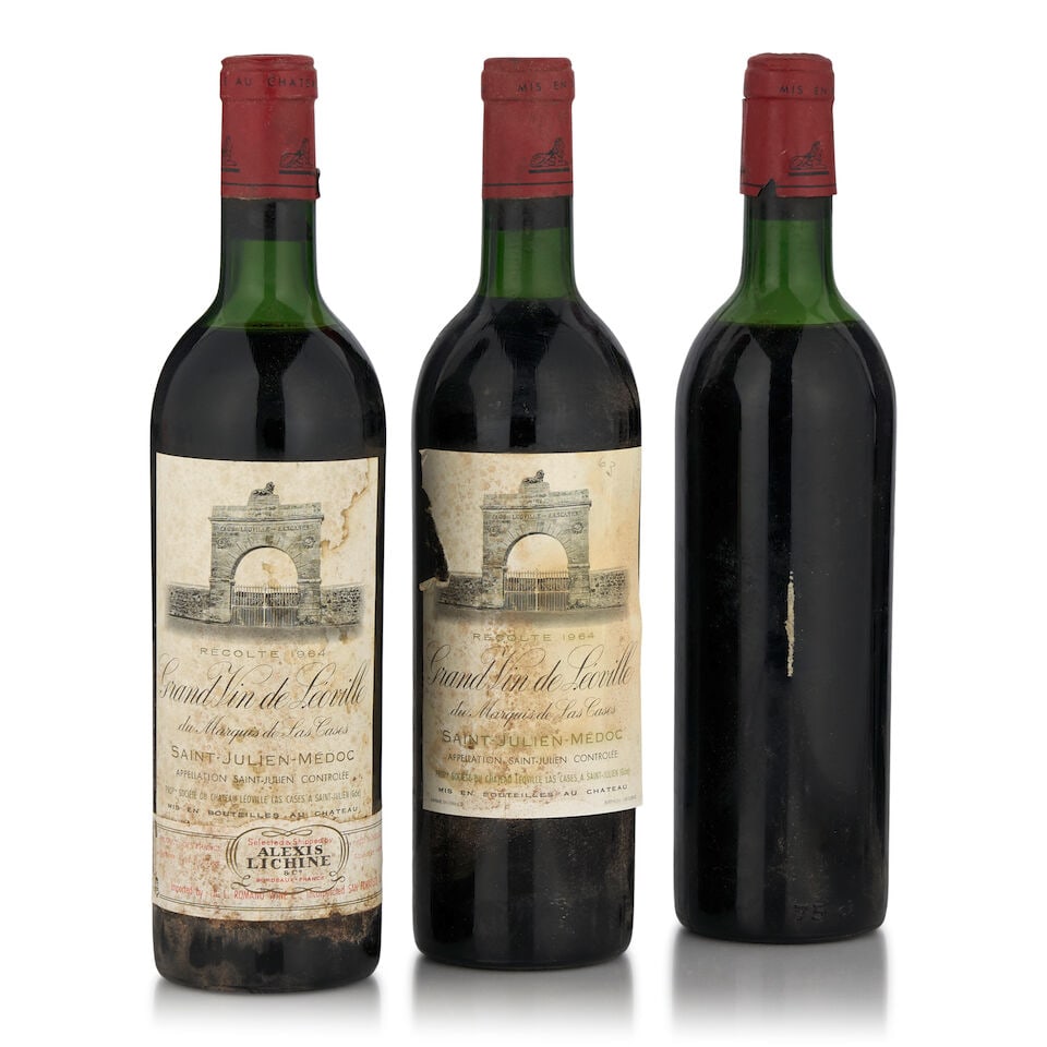 Château Léoville-Las Cases, 1964 (3 bottles, 750ml): Château Léoville-Las Cases, 1964 (3 bottles, 750ml) Region: Saint-Julien Fill Level: one very top shoulder, two just below top shoulder Capsule: bin soiled, nicked, one cut by Bonhams' speci