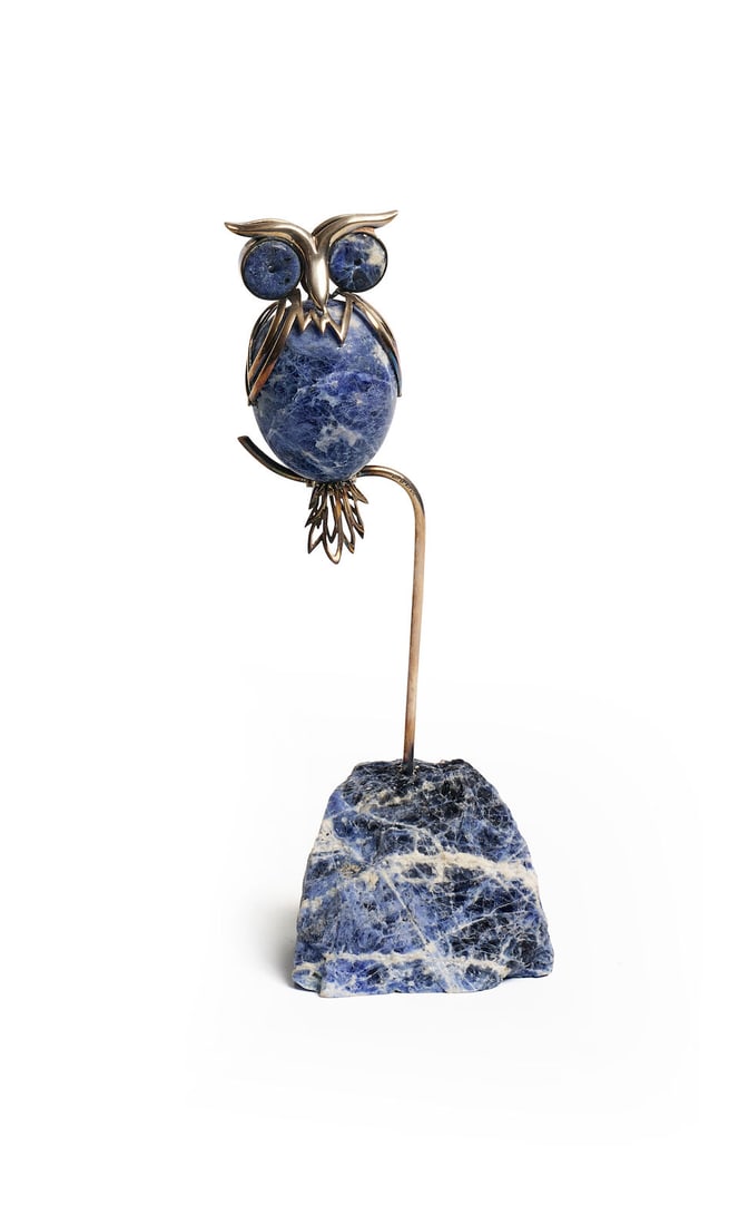 Ilias Lalaounis | Sodalite owl sculpture: Ilias Lalaounis | Sodalite owl sculpture With sodalite eyes, torso and rocky base, applied with sterling silver details and perched on a wire branch, stamped with makers mark, 925 Greece A21, height 2