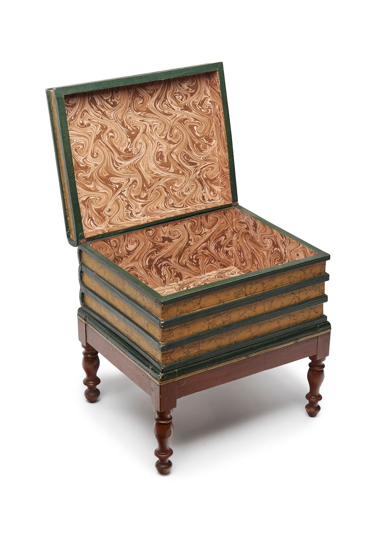 A library occasional table of faux books formed as a stack of books on a stand, height: 45.0cm, ...: A library occasional table of faux books formed as a stack of books on a stand, the spines marked 'LES MYSTERES DE PARIS' with hinged top lid and marbled paper interior, on integral stand, height: 45.
