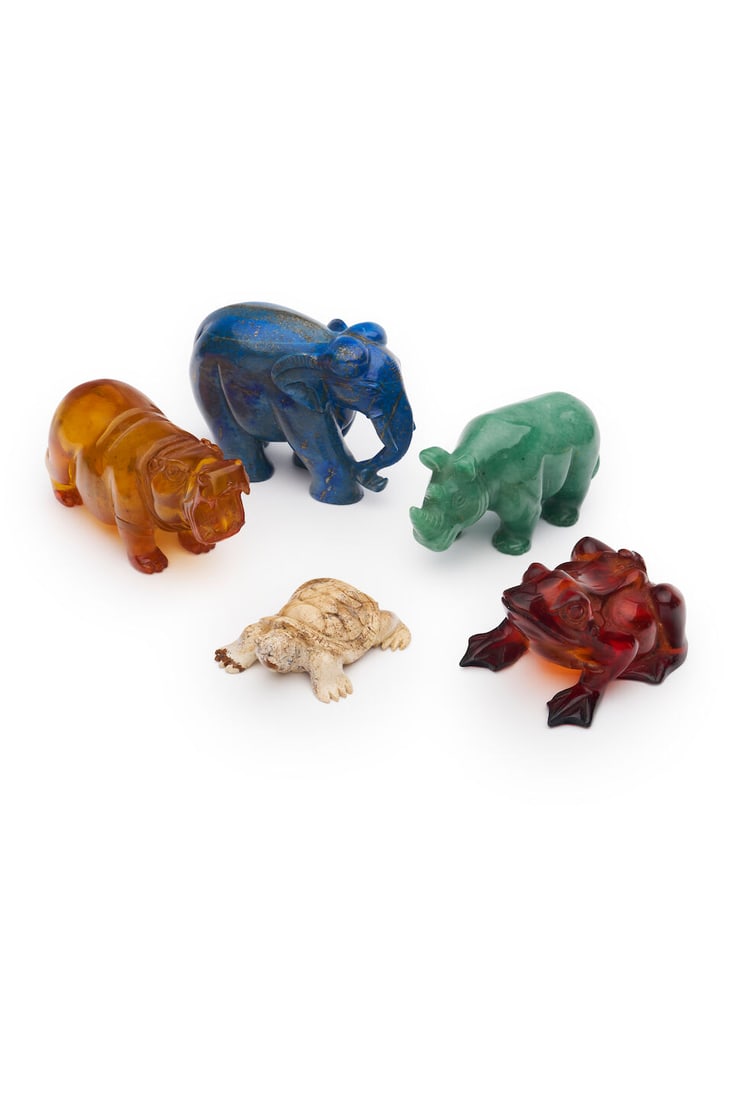 An assembled group of five carved animals height: elephant 8.5cm, rhinoceros and hippopotamus 7...: An assembled group of five carved animals including an elephant of lapis lazuli, a rhinoceros of jade, an hippopotamus and frog of amber, and a turtle, height: elephant 8.5cm, rhinoceros and hippopota