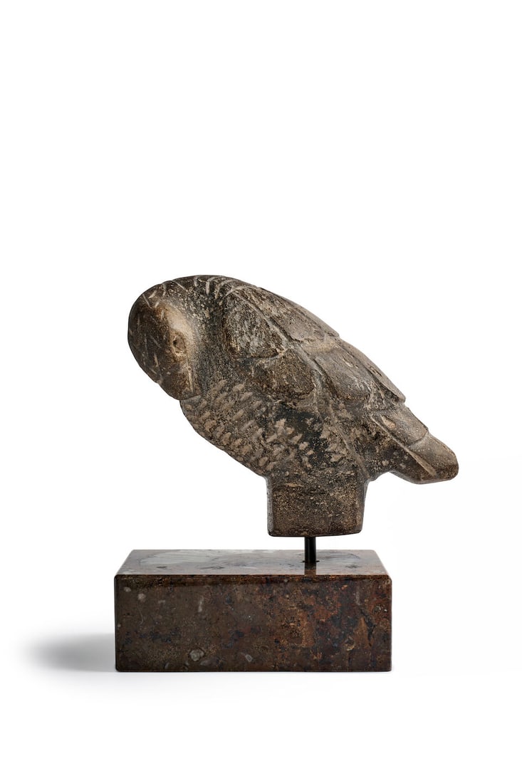An early Avian sculpture height: 19.0cm excluding plinth: An early Avian sculpture carved in light gray stone, the bird with its head resting to one side, on a hardstone faced plinth, height: 19.0cm excluding plinth Footnotes: Provenance David Jones Art Gall