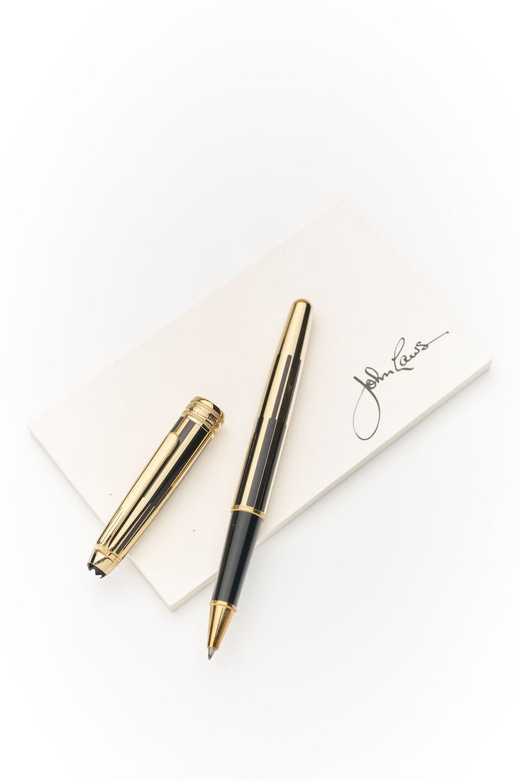 Montblanc | Meisterstück Solitaire Classique Rollerball: Montblanc | Meisterstück Solitaire Classique Rollerball gilt metal with black enamel detail, numbered ML2474941, length 13.7cm. For further information on this lot please visit Bonhams.com For fu