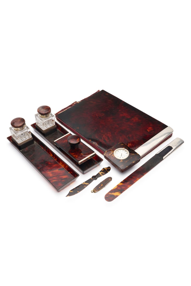 Collection of tortoise shell writing accessories (9): Collection of tortoise shell writing accessories Comprising Asprey writing compendium, with sterling silver mount London circa 1914; Page turner with sterling silver handle hallmarked London circa 190