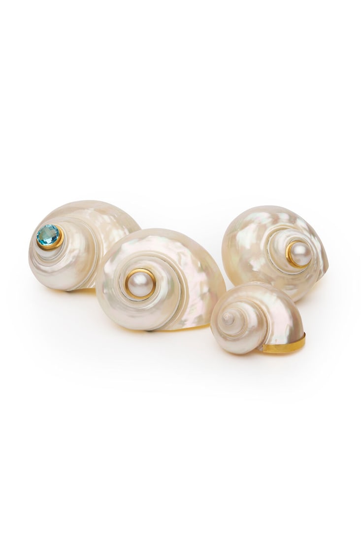 Maria Rosaria Cataldo | Group of four shells: Maria Rosaria Cataldo | Group of four shells Two polished Turbo shells set with mabe pearls, one polished turbo shell set with checkerboard-cut circular shaped blue topaz, singular polished turbo shel