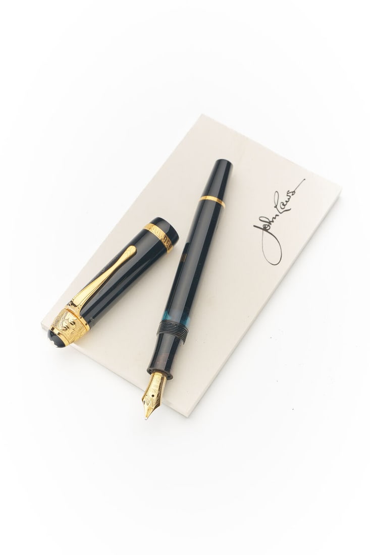 Montblanc | 'Voltaire' limited edition 'Writers Series' fountain pen: Montblanc | 'Voltaire' limited edition 'Writers Series' fountain pen Model: Writer's Series, Voltaire, Limited Edition No. 19033 / 20,000 Cap/Barrel/Clip: Black resin with vermeil cap top, rings and c