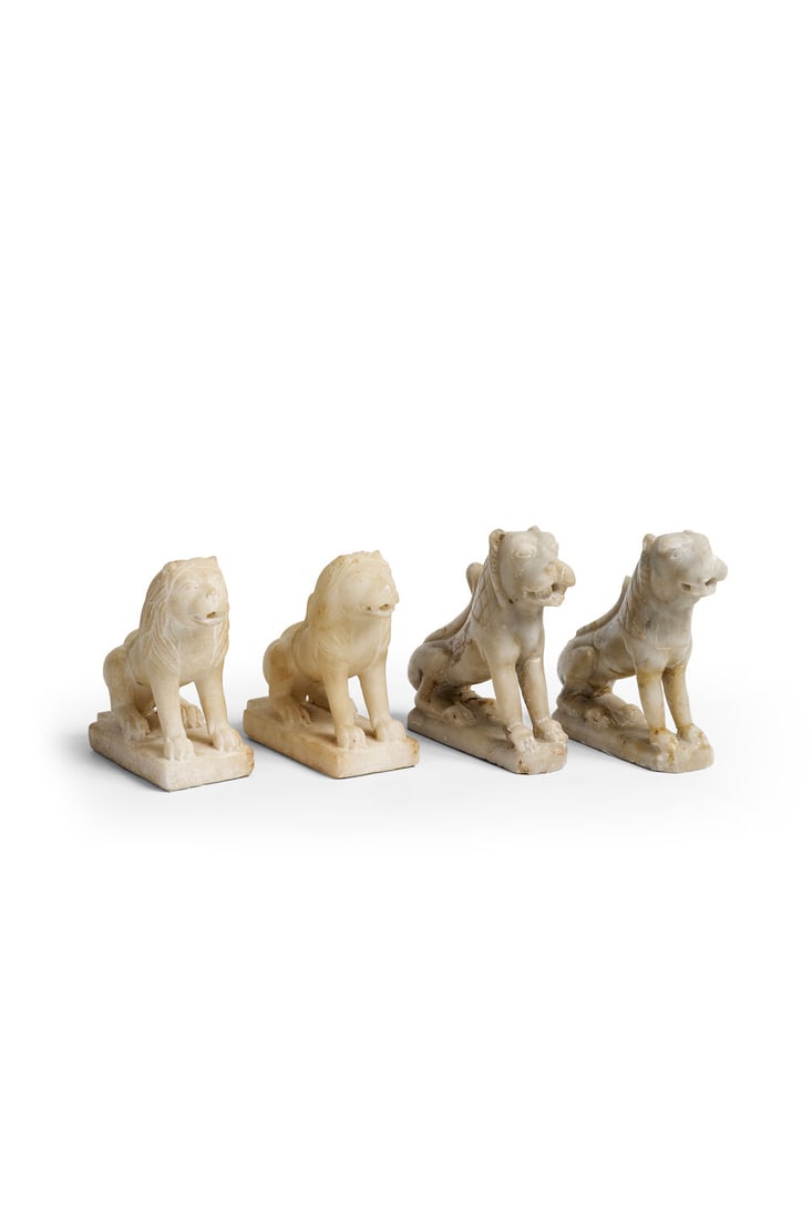 Two pairs of marble lions likely Indian, height: 13.0 - 14.0cm 4: Two pairs of marble lions likely Indian, on integral stands, height: 13.0 - 14.0cm 4 For further information on this lot please visit Bonhams.com For further information about this lot please visit