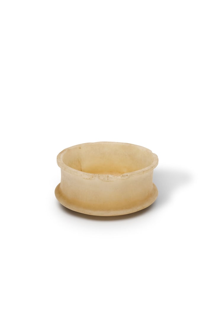 An Egyptian alabaster bowl New Kingdom, 1550-1069 B.C. height: 6.5cm, width: 14.5cm (1 of 1)