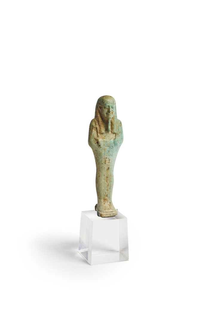 An Egyptian turquoise glazed faience shabti Late Period, circa 664-332 B.C. height: 13.5cm (1 of 1)