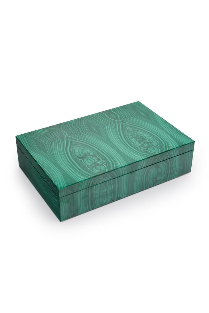 A large malachite box: A large malachite box rectangular with hinged cover revealing a black glass lined interior, measuring 29.3 x 19.3 x 7.5cm. For further information on this lot please visit Bonhams.com For further info