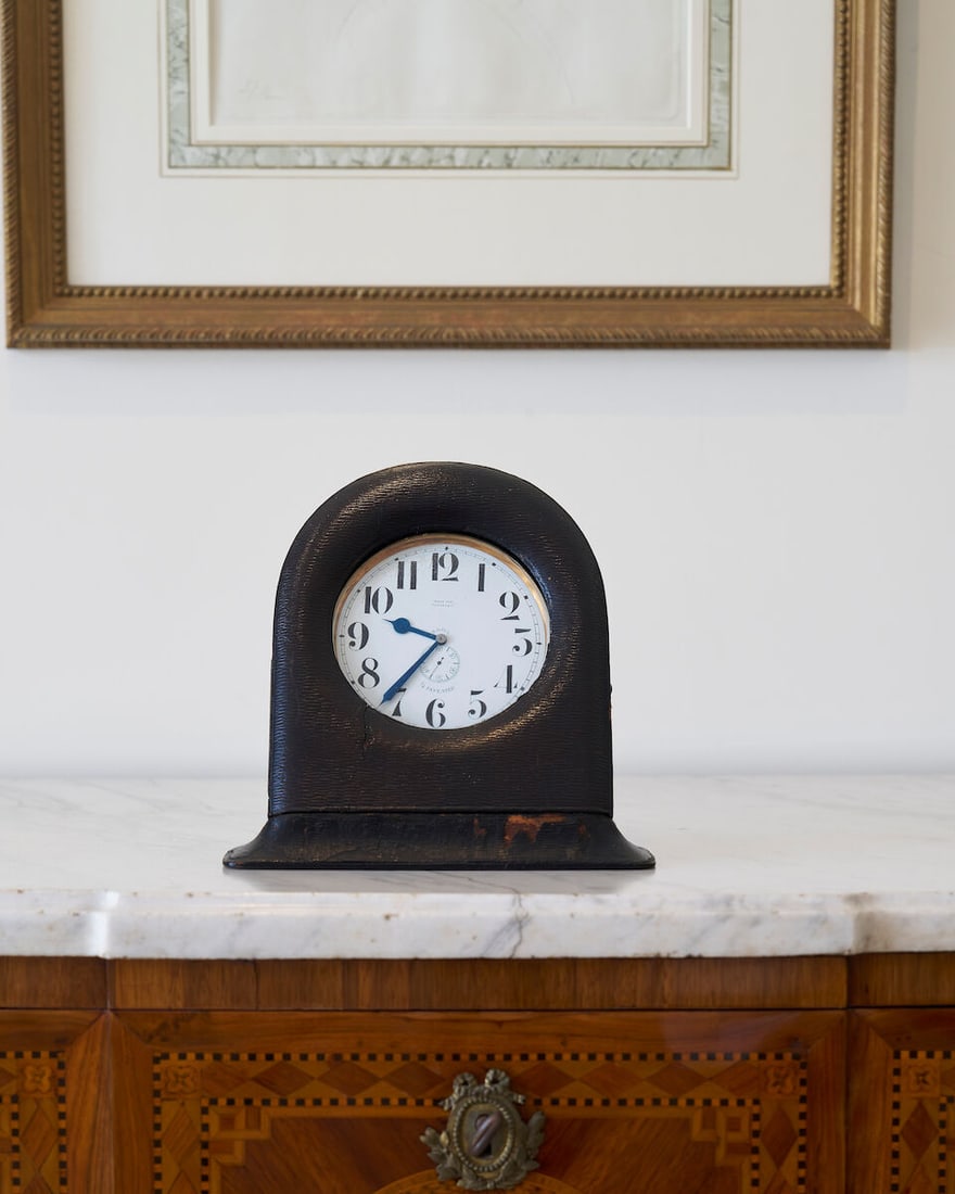 A good early Swiss quarter-repeating keyless lever eight-day 'Goliath' watch in a leather-covere...: A good early Swiss quarter-repeating keyless lever eight-day 'Goliath' watch in a leather-covered desk stand 20th century, Retailed by Tiffany & Co. The white enamel Arabic dial with subsidiary second