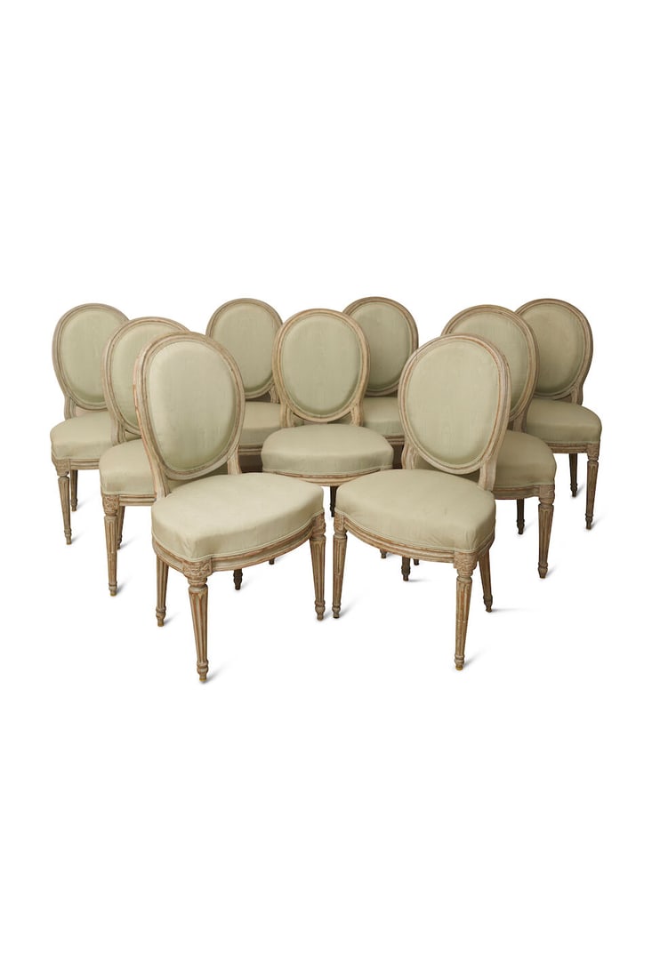 A matched set of nine Louis XVI chairs, French, height: 89.0cm, width: 49.0cm, depth: 43.0cm: A matched set of nine Louis XVI chairs, French, on tapering fluted legs, with oval padded backs and pale green silk upholstery, a pair stamped Pierre Bernard, a pair stamped Pierre Francois Cefert, an