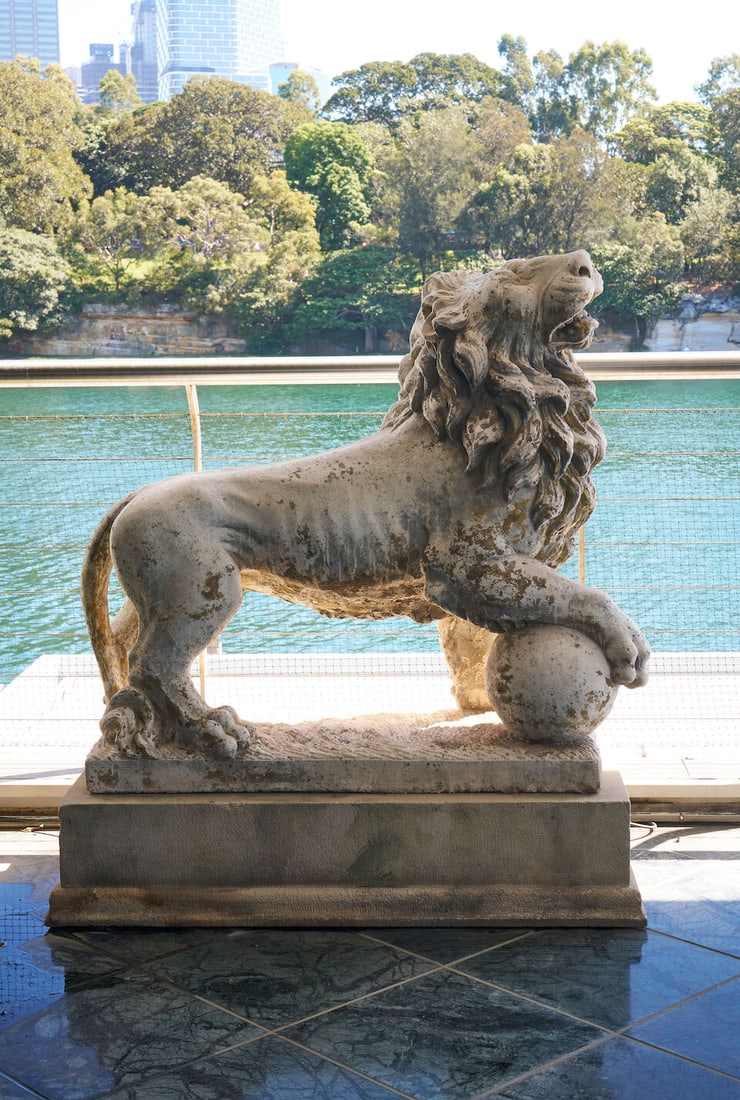 A pair of cast stone Medici lions,: A pair of cast stone Medici lions, on stepped sandstone bases, height overall: 133.0cm, width: 117.0cm depth: 31.0cm (lion's mane) This lot is subject to the following lot symbols: W TP W Please note 
