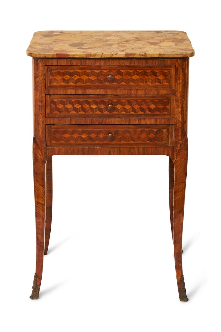 A Louis XV / Louis XVI occasional table, French, late 18th century,: A Louis XV / Louis XVI occasional table, French, late 18th century, transitional piece with Kingwood parquetry, three drawer cabinet with tapering legs terminating with sabots, stone top, height: 69.5