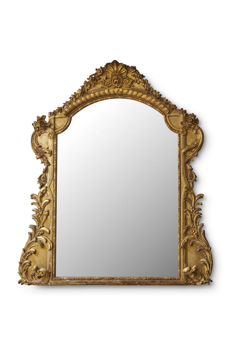 A giltwood salon mirror,: A giltwood salon mirror, decorated with floral motifs, with early plate, height: 185.0cm, width: 162.0cm This lot is subject to the following lot symbols: TP TP Please note this lot is available for c